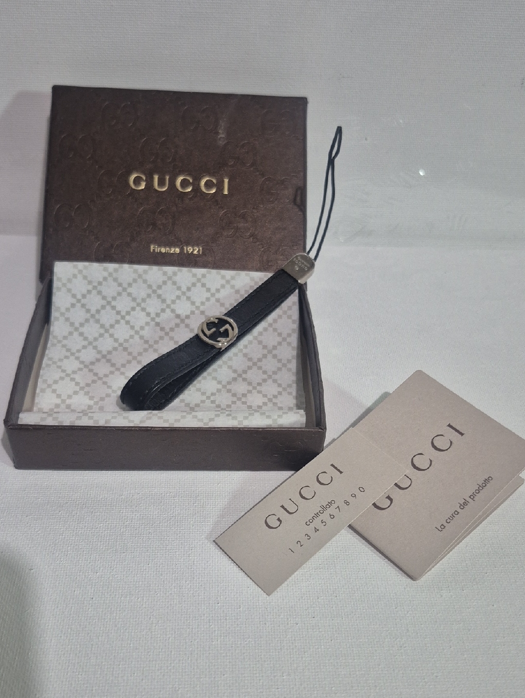 Gucci Black Leather Wristlet Strap With Silver Gg Charm